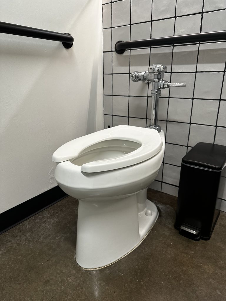 A commercial plumbing toilet